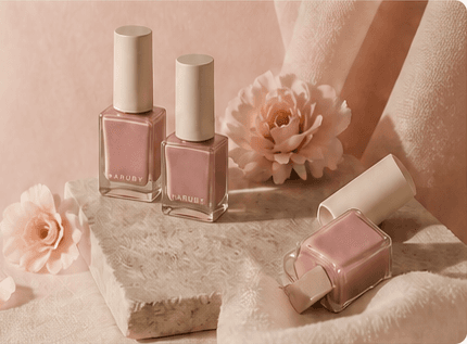Rose, nude, and plum nail samples arranged on ivory washi paper